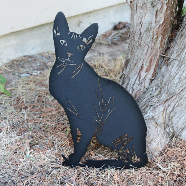 Sphynx Corten steel dog silhouette, matte black finish, shown outdoors – My Metal Rescue