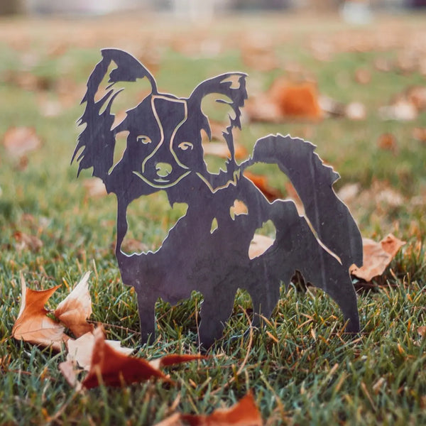 Papillon Corten steel dog silhouette, raw polished steel finish, shown outdoors – My Metal Rescue
