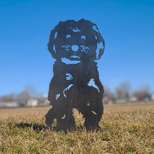 Maltese Corten steel dog silhouette, raw polished steel finish, shown outdoors – My Metal Rescue