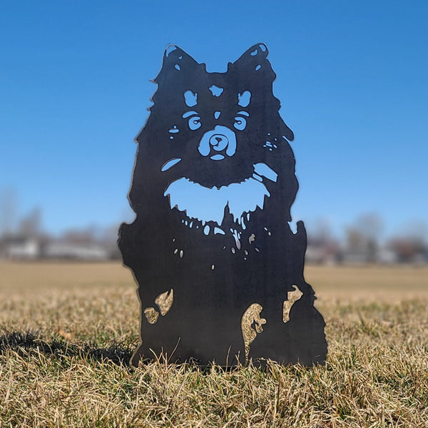 Pomeranian Corten steel dog silhouette, raw polished steel finish, shown outdoors – My Metal Rescue