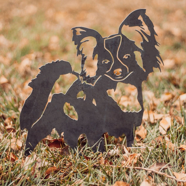 Papillon Corten steel dog silhouette, raw polished steel finish, shown outdoors – My Metal Rescue