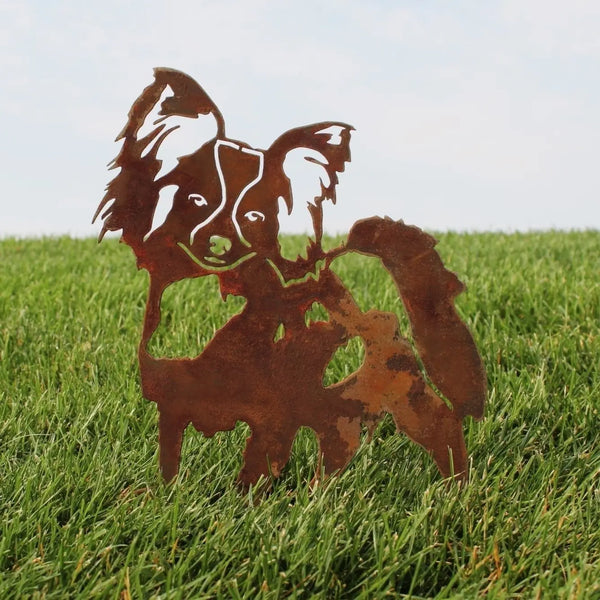 Papillon Corten steel dog silhouette, rusted patina finish, shown outdoors – My Metal Rescue